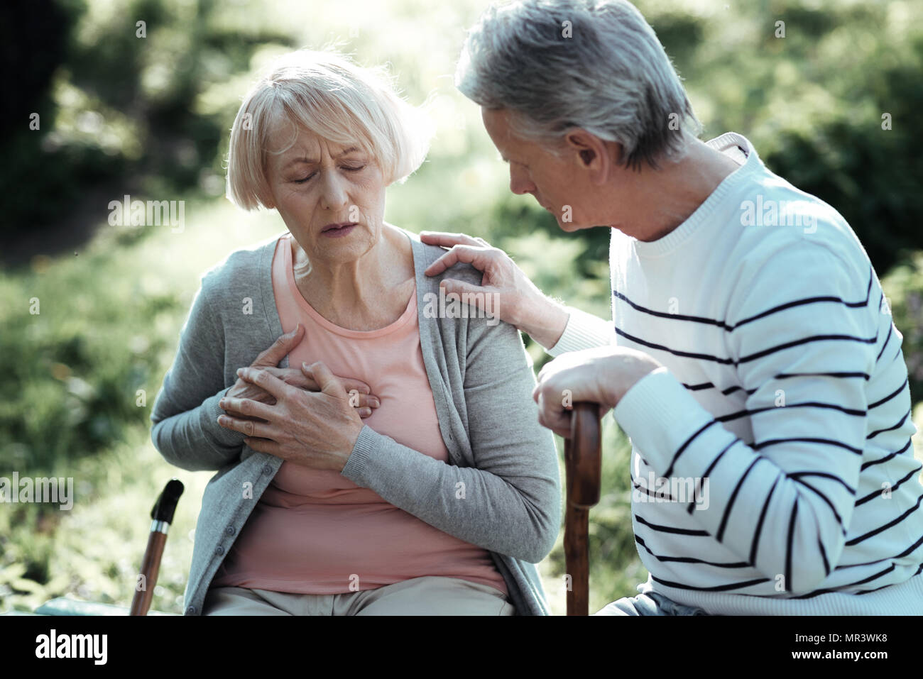 Elderly female person having pain Stock Photo