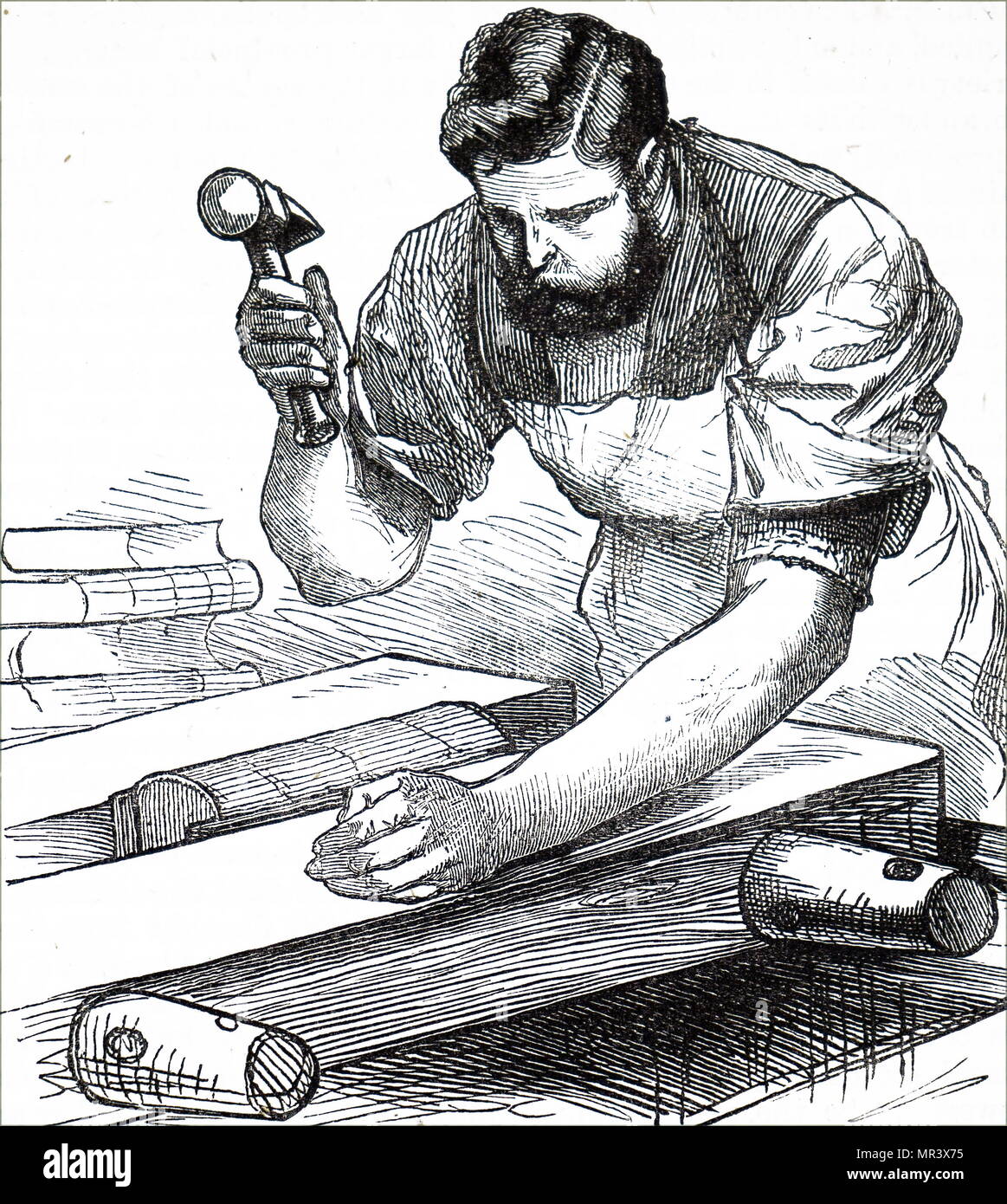 Engraving depicting a process in bookbinding: rounding the back of sewn sections to produce swell to strengthen the spine and ensure proper opening of the bound volume. Dated 19th century Stock Photo