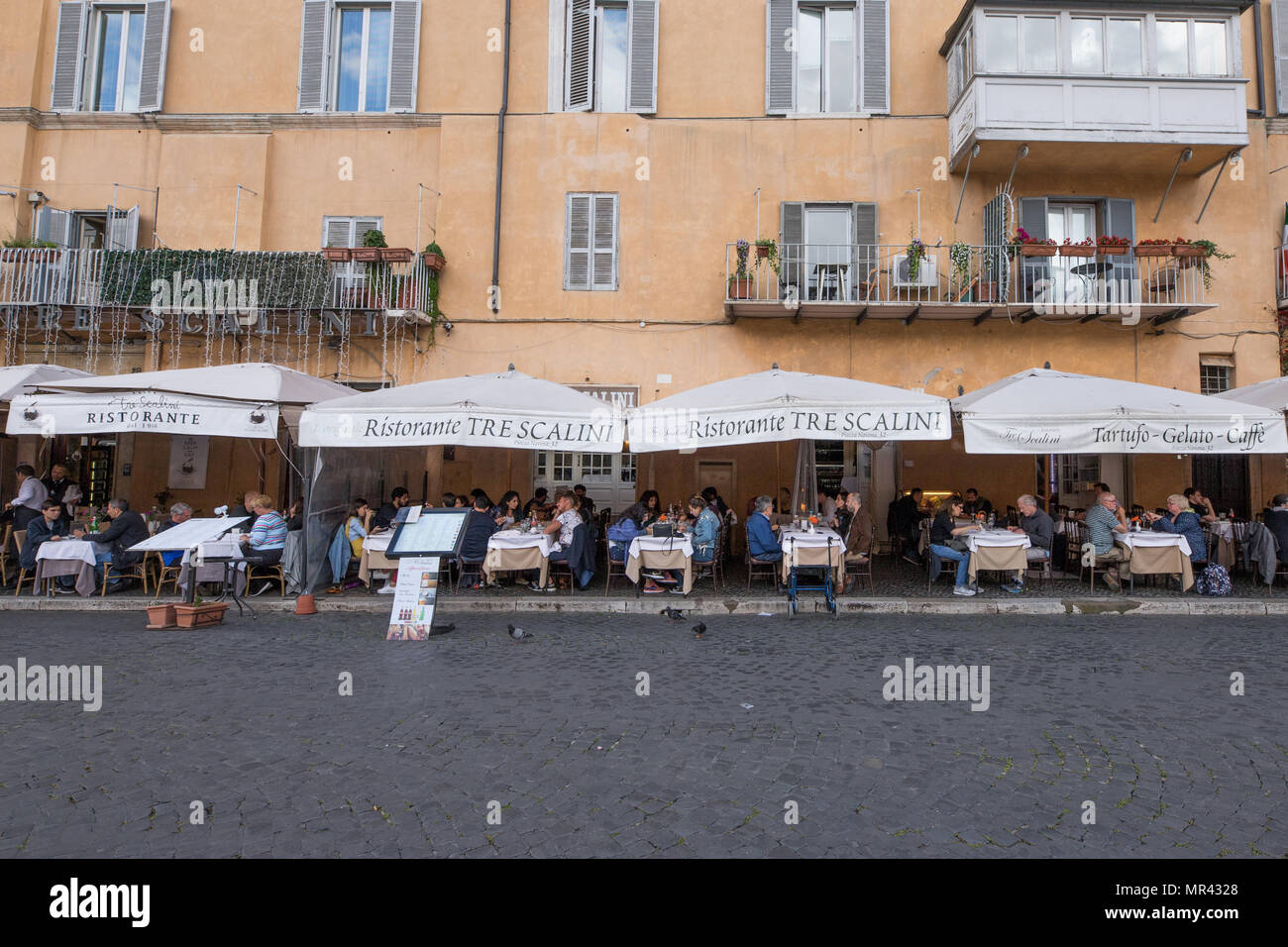 Restaurant pizzeria Piazza Navona, people tourists sitting terrace in