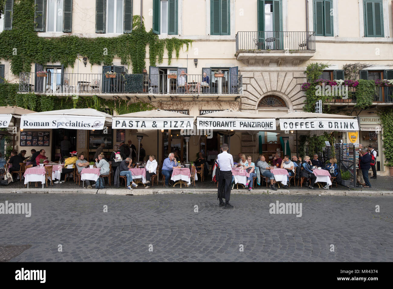 Restaurant pizzeria Piazza Navona, people tourists sitting terrace in