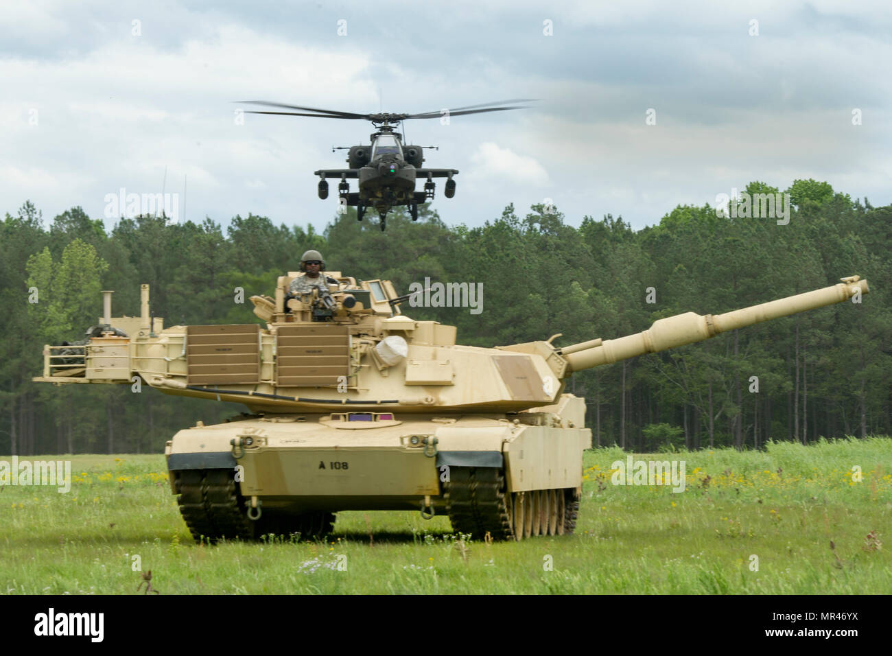 A U.S. Army M1 Abrams Main Battle Tank and a AH64 Attack helicopter