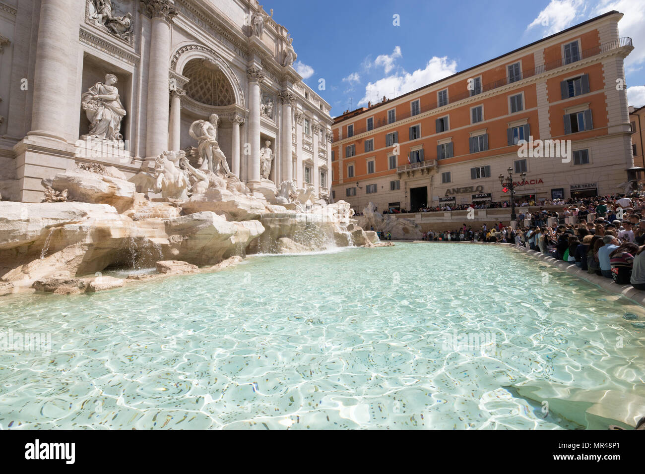 Rome Trevi Fountain, a multitude of tourists visiting the capital city ...