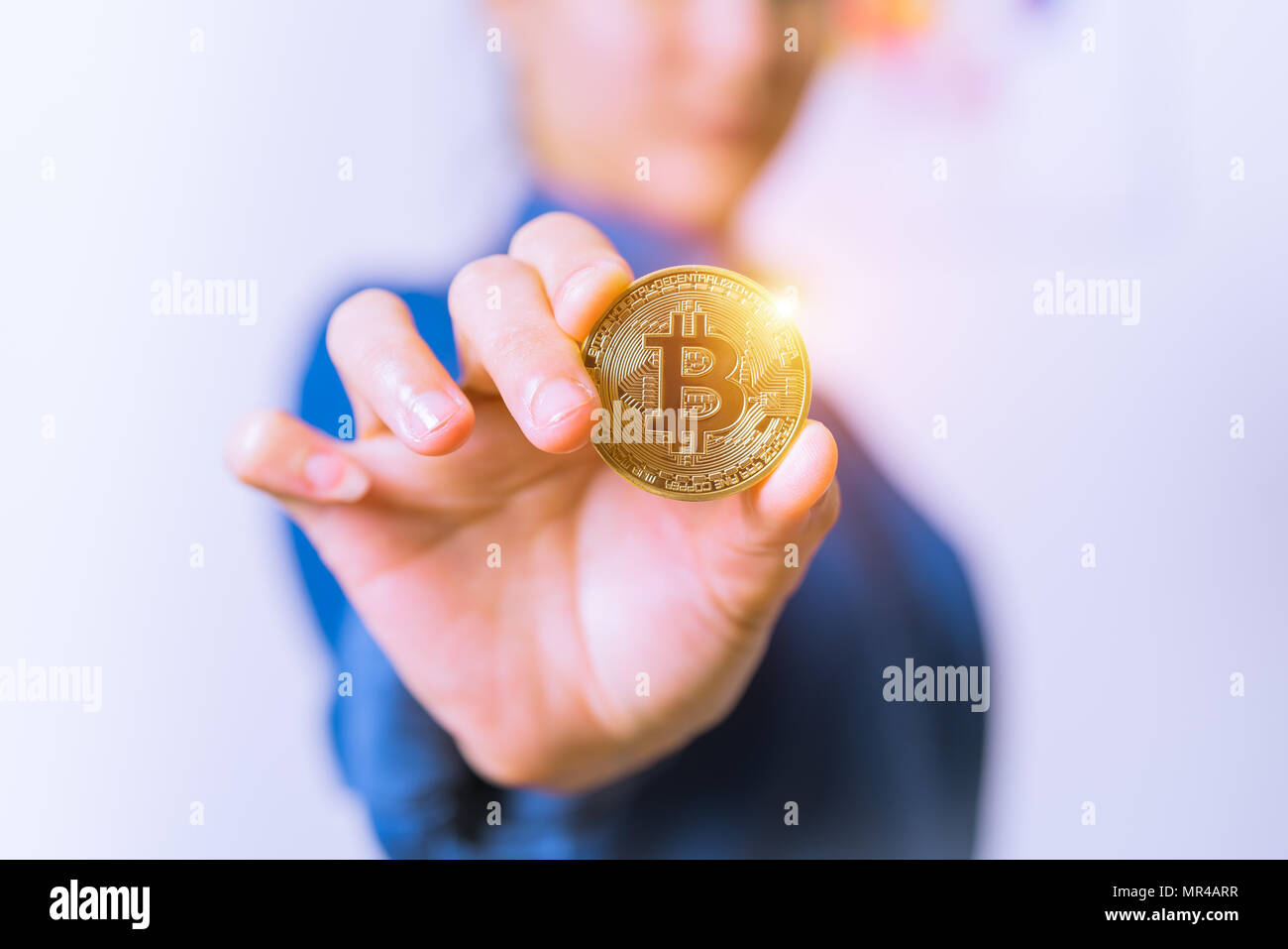 cryptocurrency coins - Bitcoin, Ethereum, Litecoin, Ripple. Women hold the cryptocurrency  coin on hand. Physical bitcoins gold and silver coins Stock Photo - Alamy