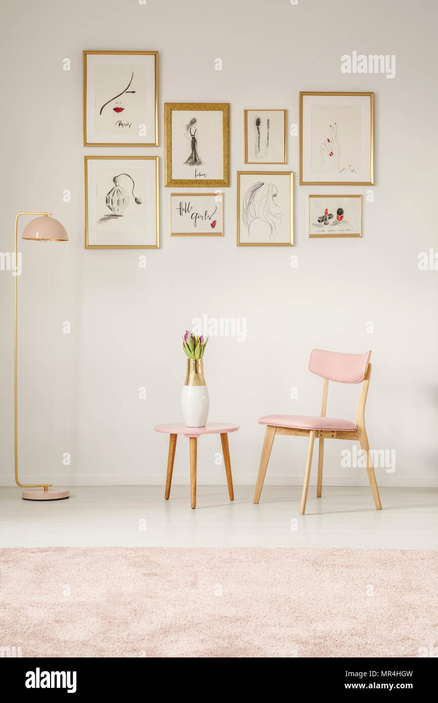 Paintings In Golden Frames Pink Chair Table And Lamp Set On The White Paintings In Golden Frames Pink Chair Table And Lamp Set On The White