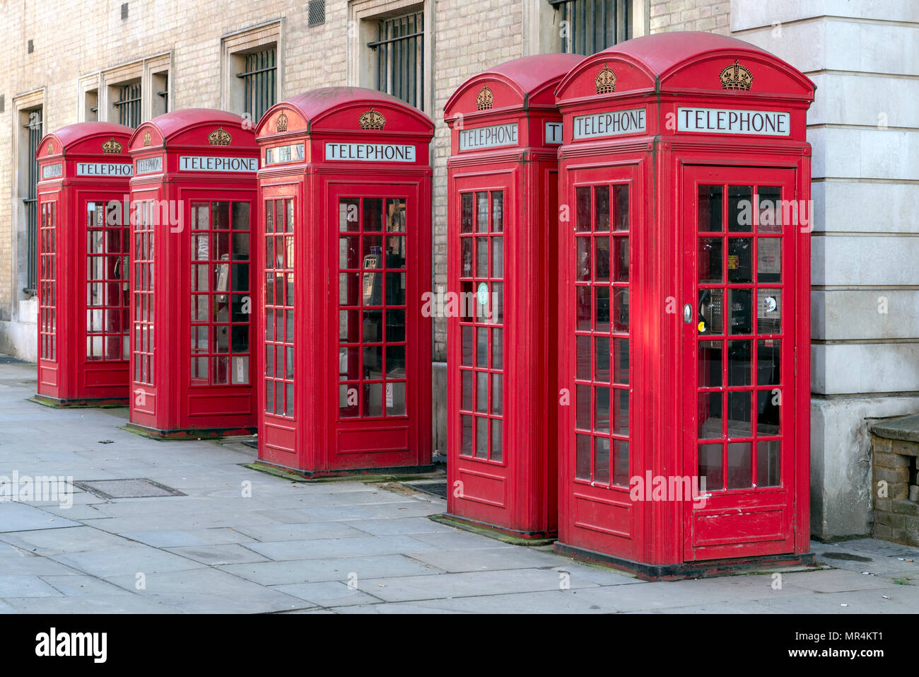 Four red telephone booths inline Stock Photo