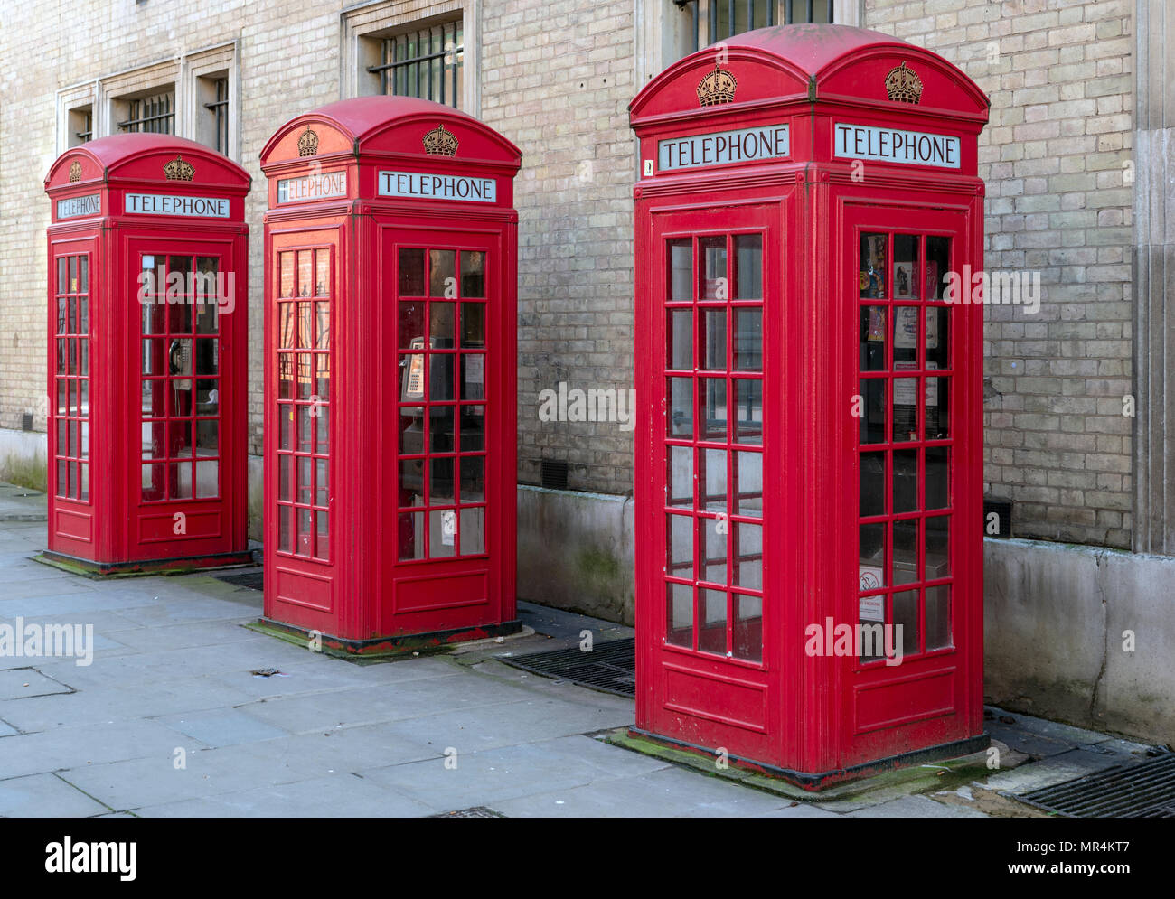 Four red telephone booths inline Stock Photo
