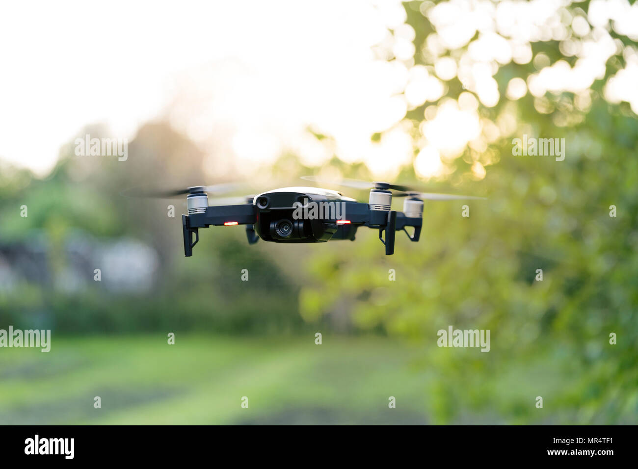 Flying quadrocopter, remote controlled drone with camera Stock Photo
