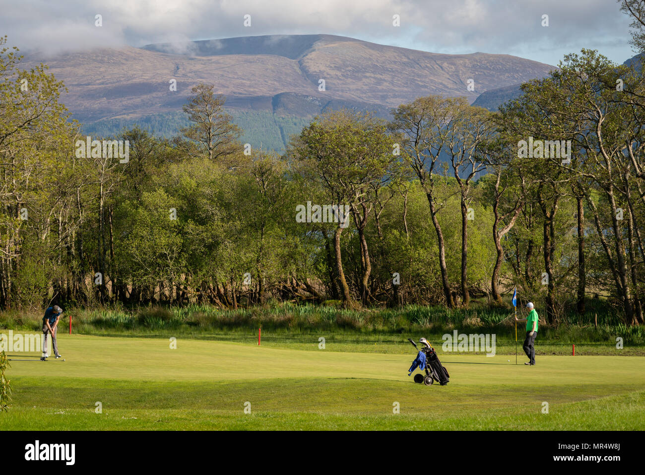 Two golfers playing golf at golf course with picturesque scenery, Golf and Fishing Club, Fossa