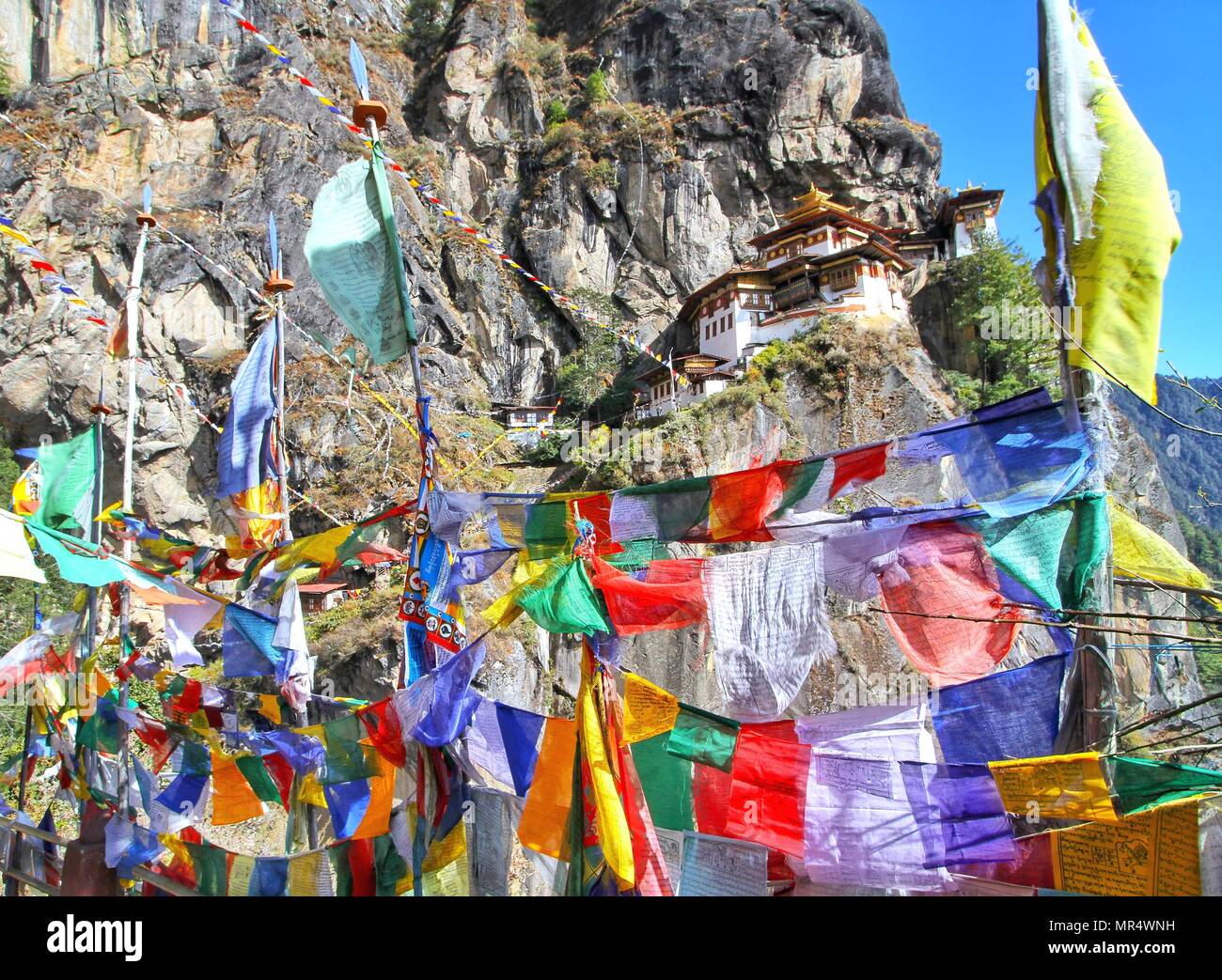 Colorful Buddhist prayer flags at Taktshang Goemba or Tiger's nest ...