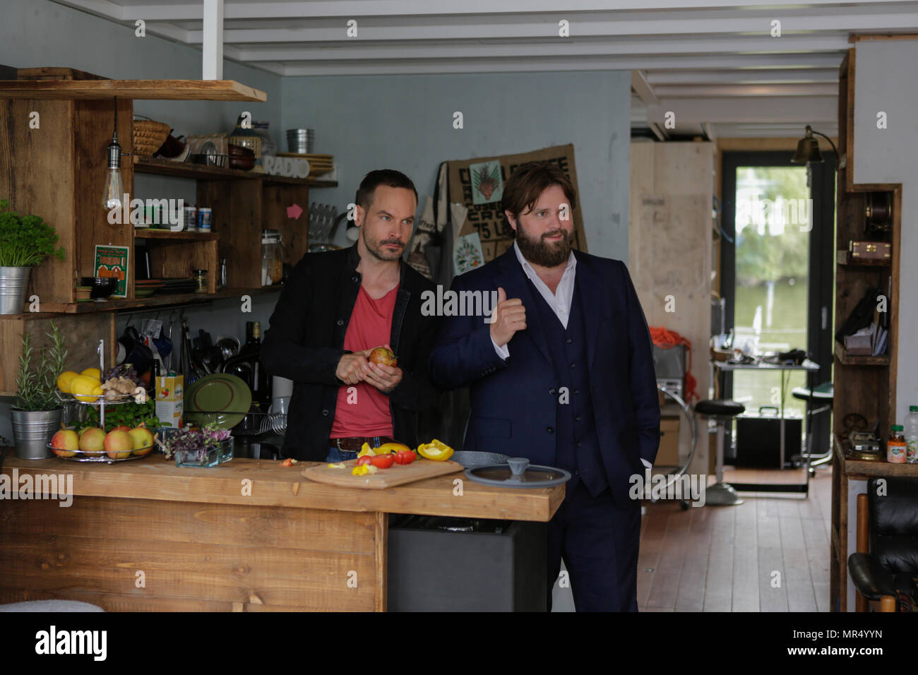 Actors Wanja Mues (left) an (Antoine Monot, Jr. (right) pose in the kitchen of  the houseboat that is owned by Mues' character Leo in the TV show preparing food. 4 new episodes of the relaunch of the long running TV series 'Ein Fall fuer zwei’ (A case for two) are being filmed in Frankfurt for the German state TV broadcaster ZDF (Zweites Deutsches Fernsehen). It stars Antoine Monot, Jr. as defence attorney Benjamin ‘Benni’ Hornberg and Wanja Mues as private investigator Leo Oswald. The episodes are directed by Thomas Nennstiel. The episodes are set to air in October. (Photo by Michael Debets / Stock Photo