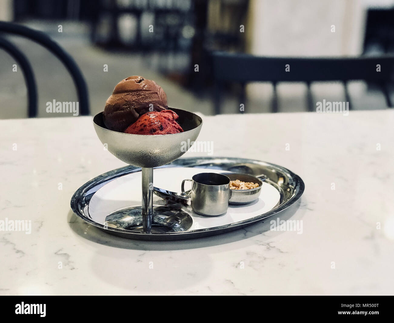 Chocolate and Cherry Ice Cream in Vintage Metal Bowl with Silver Tray. Organic Summer Dessert. Stock Photo