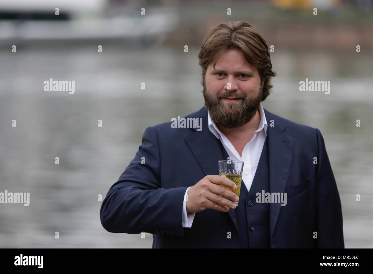 Actor Antoine Monot, Jr. poses with a glass of cider. 4 new episodes of the relaunch of the long running TV series 'Ein Fall fuer zwei’ (A case for two) are being filmed in Frankfurt for the German state TV broadcaster ZDF (Zweites Deutsches Fernsehen). It stars Antoine Monot, Jr. as defence attorney Benjamin ‘Benni’ Hornberg and Wanja Mues as private investigator Leo Oswald. The episodes are directed by Thomas Nennstiel. The episodes are set to air in October. (Photo by Michael Debets / Pacific Press) Stock Photo