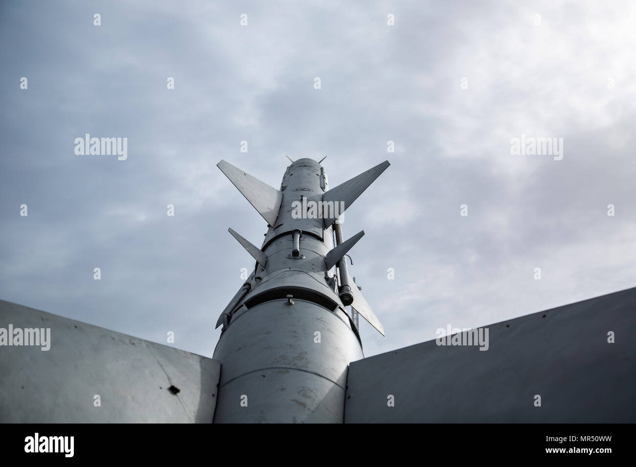 Old rocket missile on sky background Duotone Stock Photo