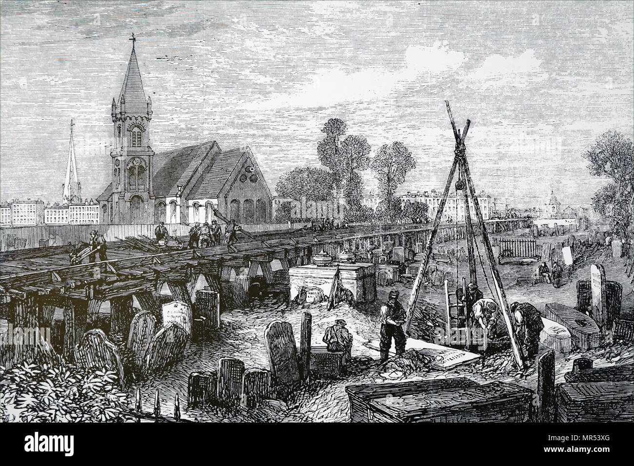Engraving depicting the construction of the Midland railway track - work in progress in Old St Pancras Churchyard, London. Dated 19th century Stock Photo