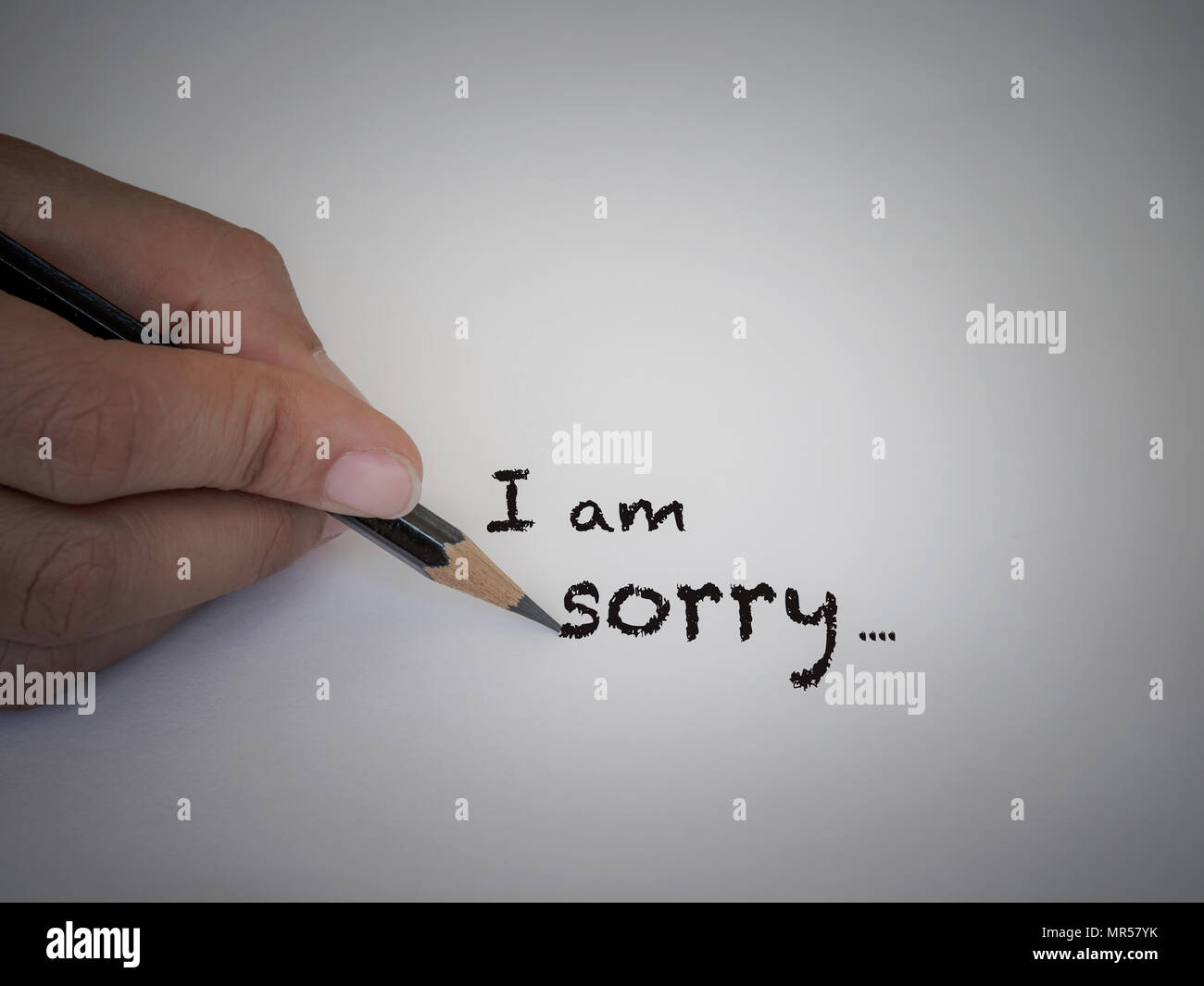 Sorry text concept write with black pencil on white background. Stock Photo
