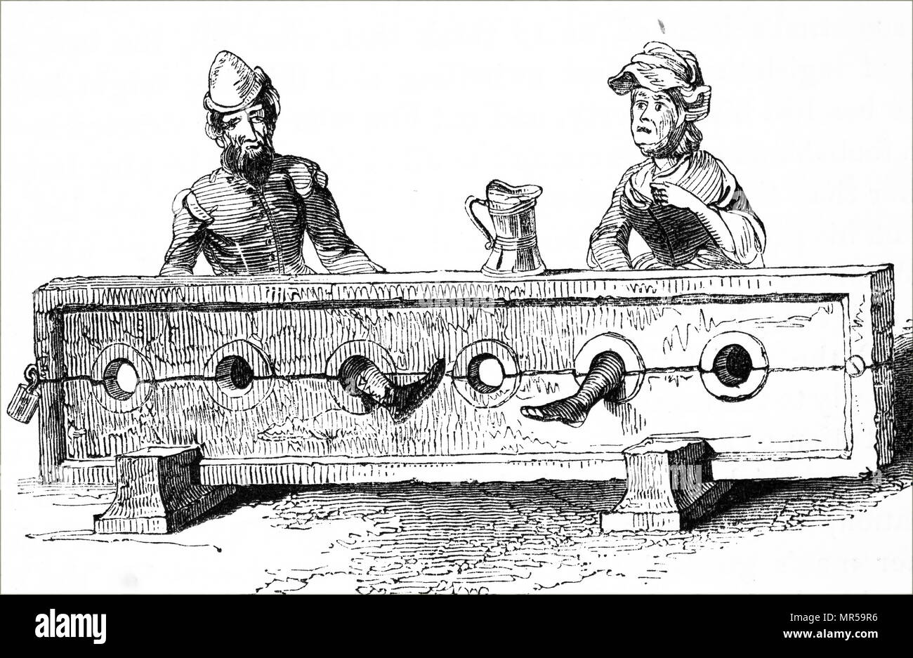 Engraving depicting a man and woman confined in the stocks as a form of public humiliation during the 15th century. Dated 19th century Stock Photo