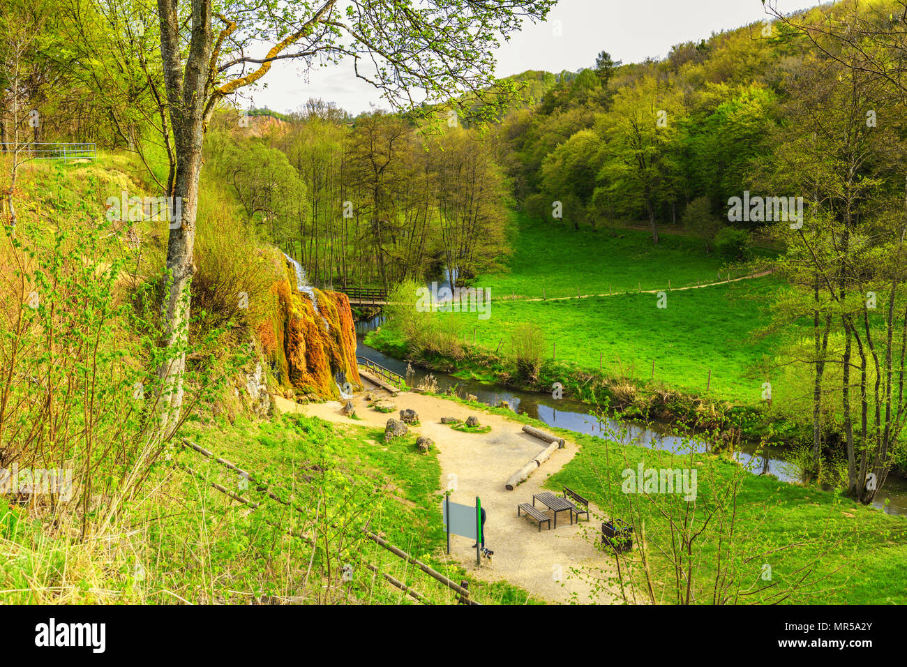 Natural monument Dreimühlen waterfall in German Eifel overgrown with mosses in wooded area falling in river Stock Photo