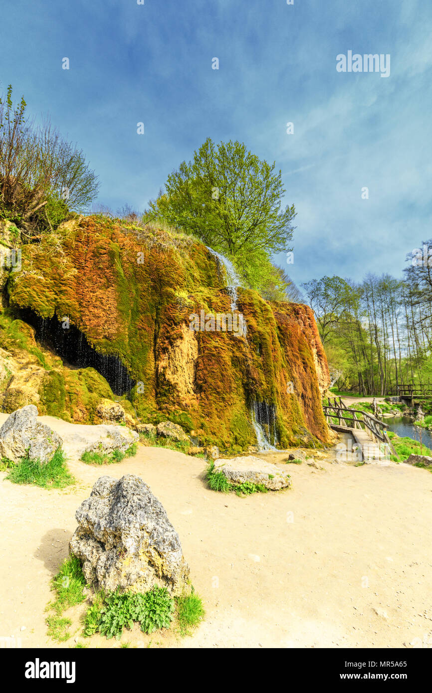 Natural monument Dreimühlen waterfall in German Eifel overgrown with mosses in wooded area falling in river Stock Photo
