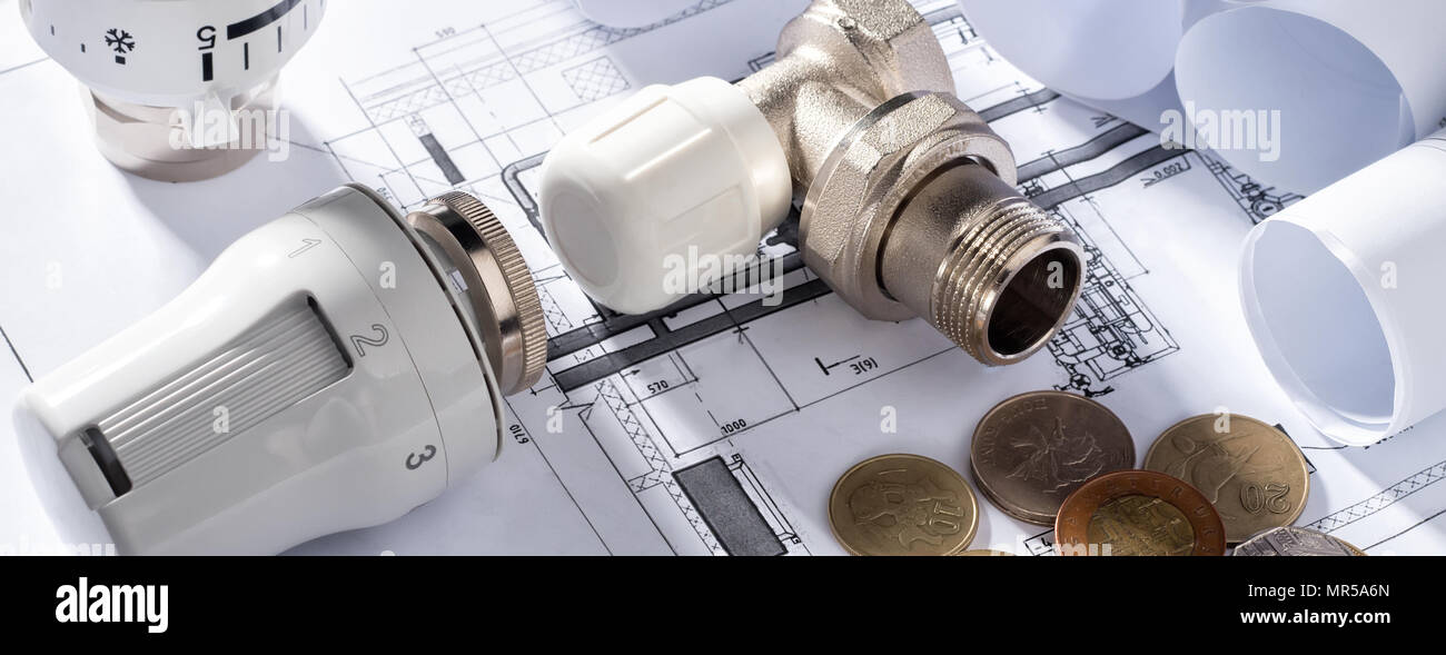 Thermostatic Head Valve for Radiator Heater Coin Money notepad for entries Heating Project Boiler room house Heat Supply Building Concept of Energy sa Stock Photo