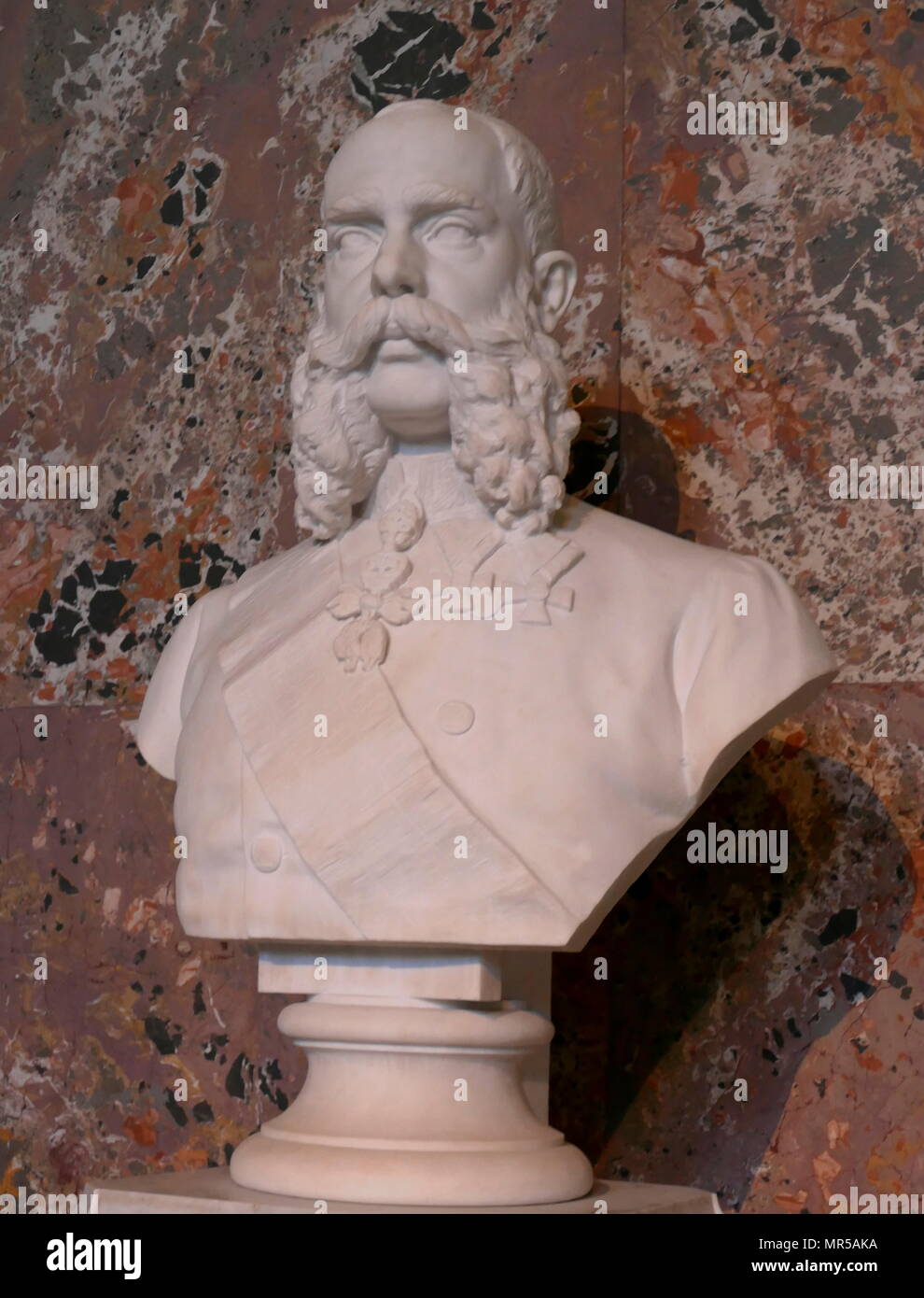 Bust of Franz Joseph I by Caspar Zumbusch 1873. Franz Joseph I (1830 – 1916) was Emperor of Austria and King of Hungary from 2 December 1848 until his death on 21 November 1916. Kaspar Zumbusch (1830 – 1915), was a German sculptor, born at Herzebrock, Westphalia, who became a pre-eminent sculptor of neo-Baroque monuments in Vienna. Stock Photo