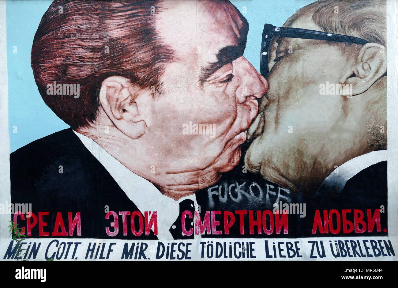 Photograph of graffiti on the Berlin Wall depicting Leonid Brezhnev (1906-1982) the former General Secretary of Central Committee of the Communist Party of the Soviet Union, embracing Erich Honneker (1912-1994) a German politician, who as the General Secretary of the Socialist Unity Party, led the German Democratic Republic from 1971 until the weeks preceding the fall of the Berlin Wall . Dated 21st Century Stock Photo