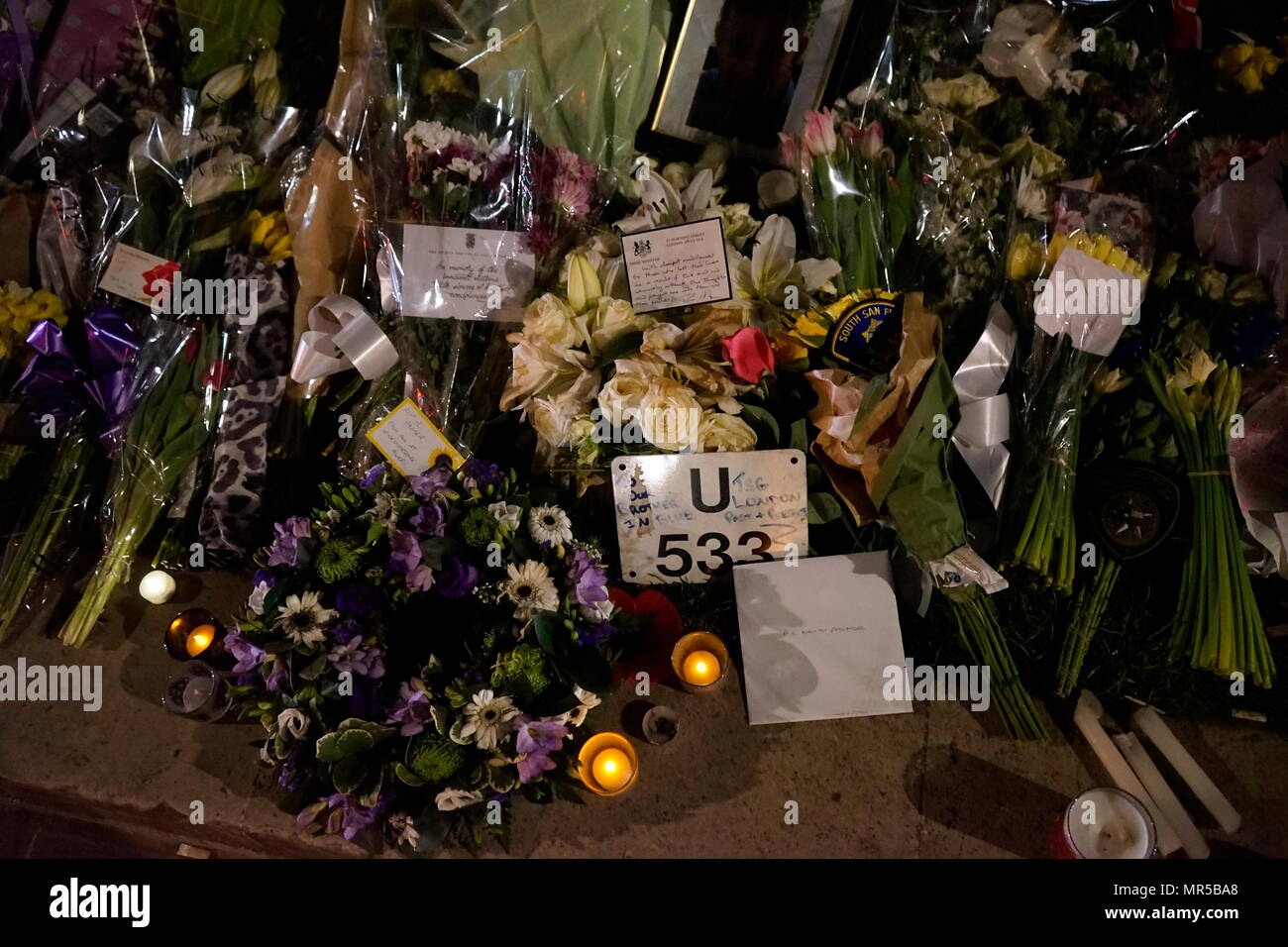 Photograph showing the tributes placed outside of Parliament in London, after the 22 March 2017, terrorist attack. The attacker, 52-year-old Briton Khalid Masood, drove a car into pedestrians on the pavement along the south side of Westminster Bridge and Bridge Street, injuring more than 50 people, four of them fatal. Dated 21st Century Stock Photo