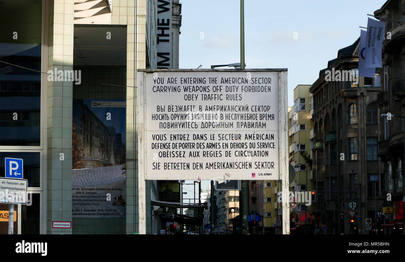 Photograph of Checkpoint Charlie (or 'Checkpoint C') was the name given by the Western Allies to the best-known Berlin Wall crossing point between East Berlin and West Berlin during the Cold War (1947–1991). Stock Photo