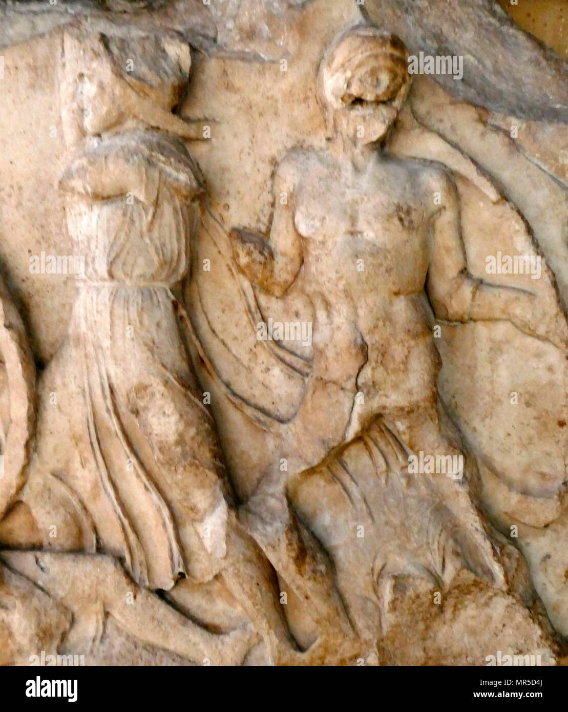 Relief from the Nereid Monument is a sculptured tomb from Xanthus in classical period Lycia, Turkey. It took the form of a Greek temple on top of a base decorated with sculpted friezes, and is thought to have been built in the early fourth century BC as a tomb for Arbinas, the Xanthian dynast who ruled western Lycia Stock Photo