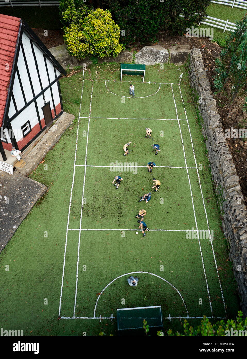 School Hockey match, in the model village at Bekonscot, Buckinghamshire, England, the oldest  model village in the world. Stock Photo