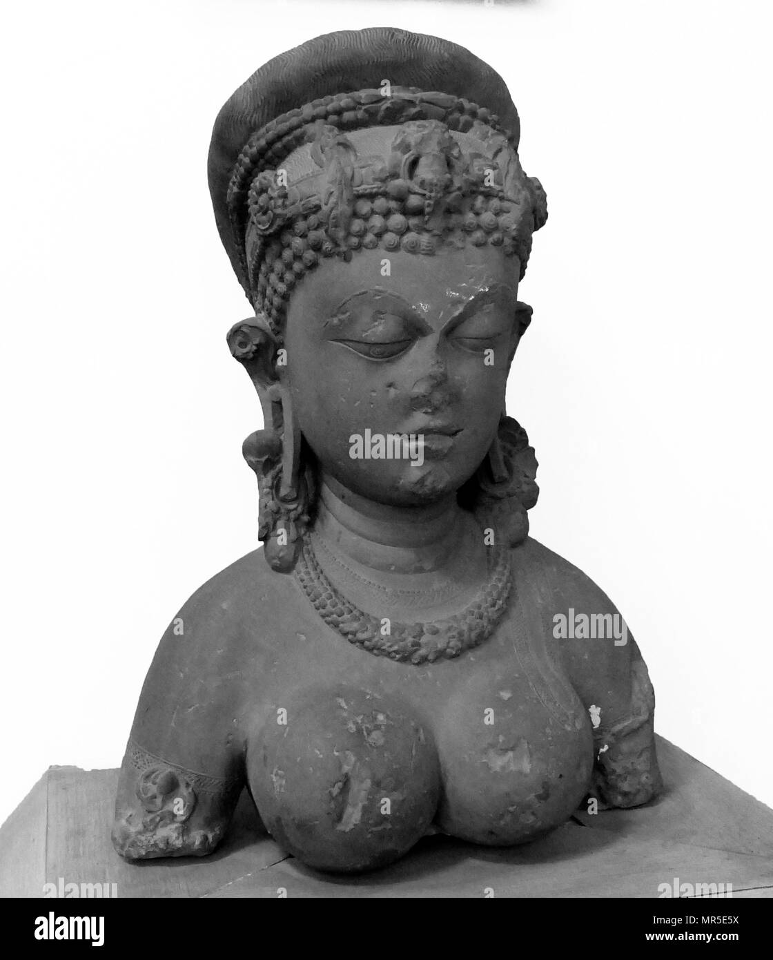 Bust of a female made of stone from Madhya Pradesh, India. Dated 9th Century Stock Photo