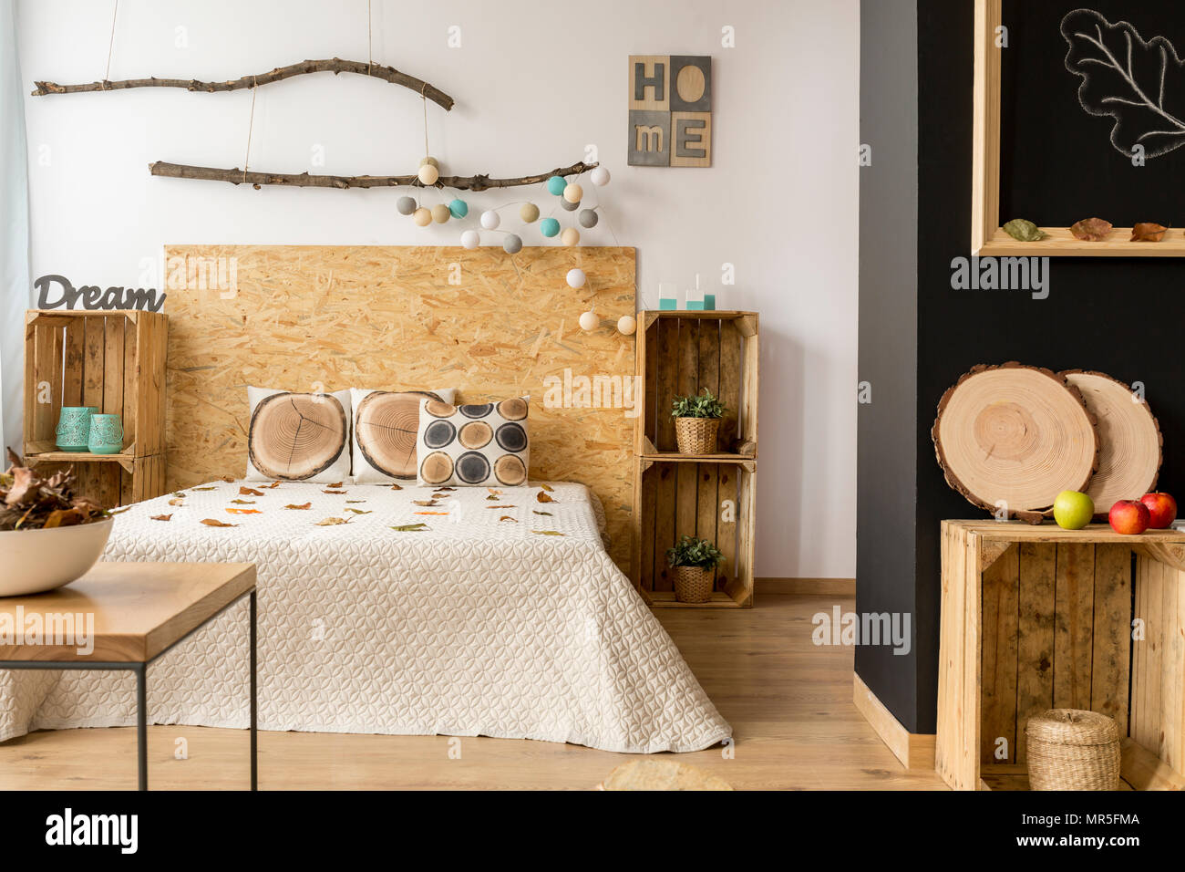 Inspiring cozy bedroom interior decorated with wooden accessories Stock ...