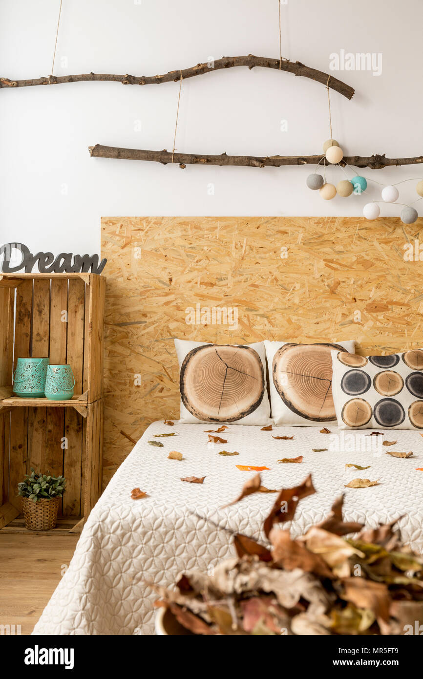 Creative brown bedroom decor full of autumn leaves Stock Photo - Alamy