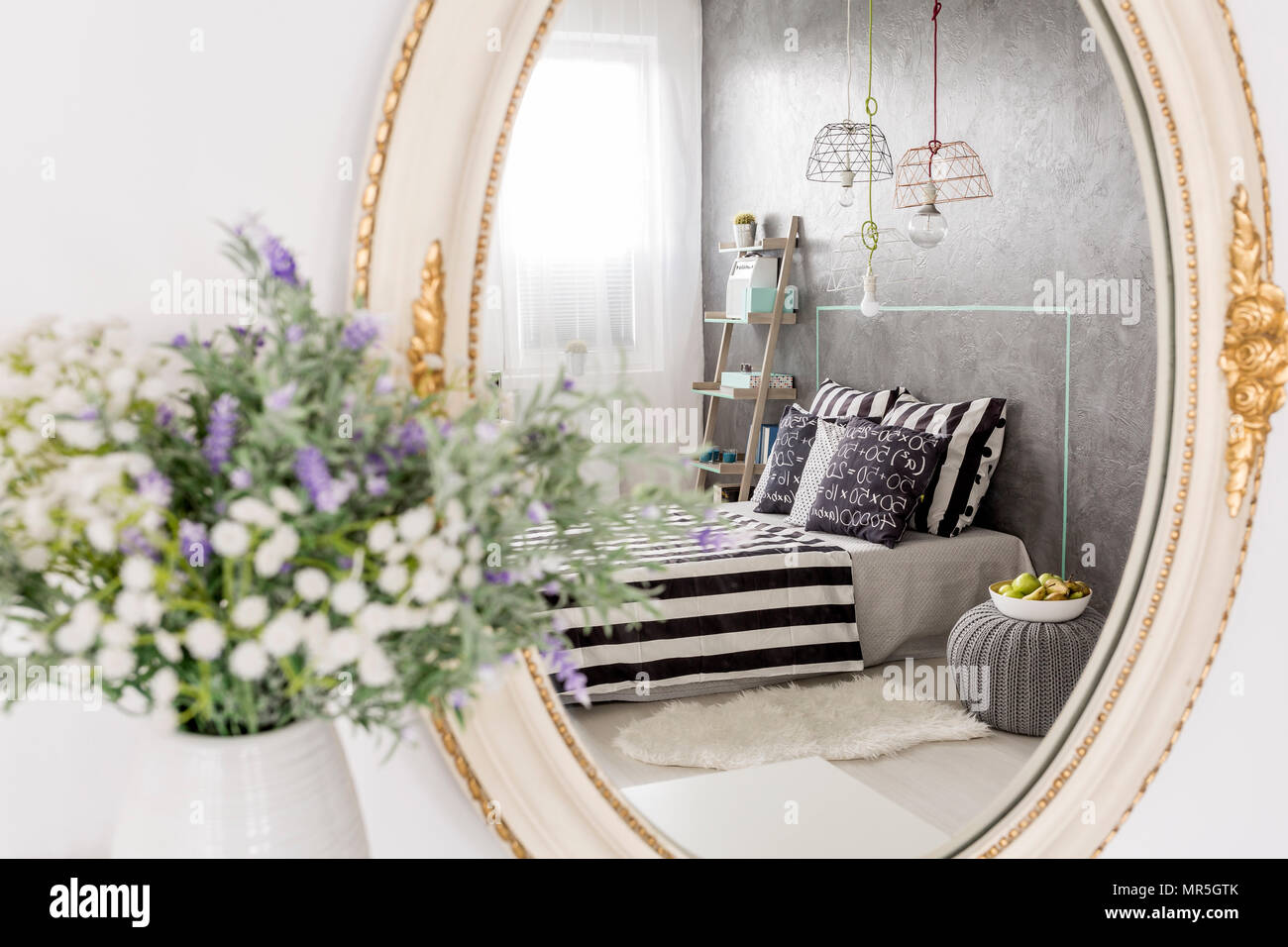 Mirror reflection of a new design bedroom, stylish round mirror with