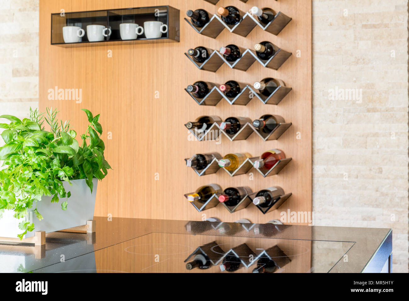 Bright kitchen interior with wine bottles Stock Photo Alamy