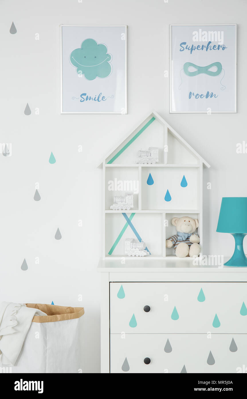 White Child Room With Wall Posters And Dresser Stock Photo