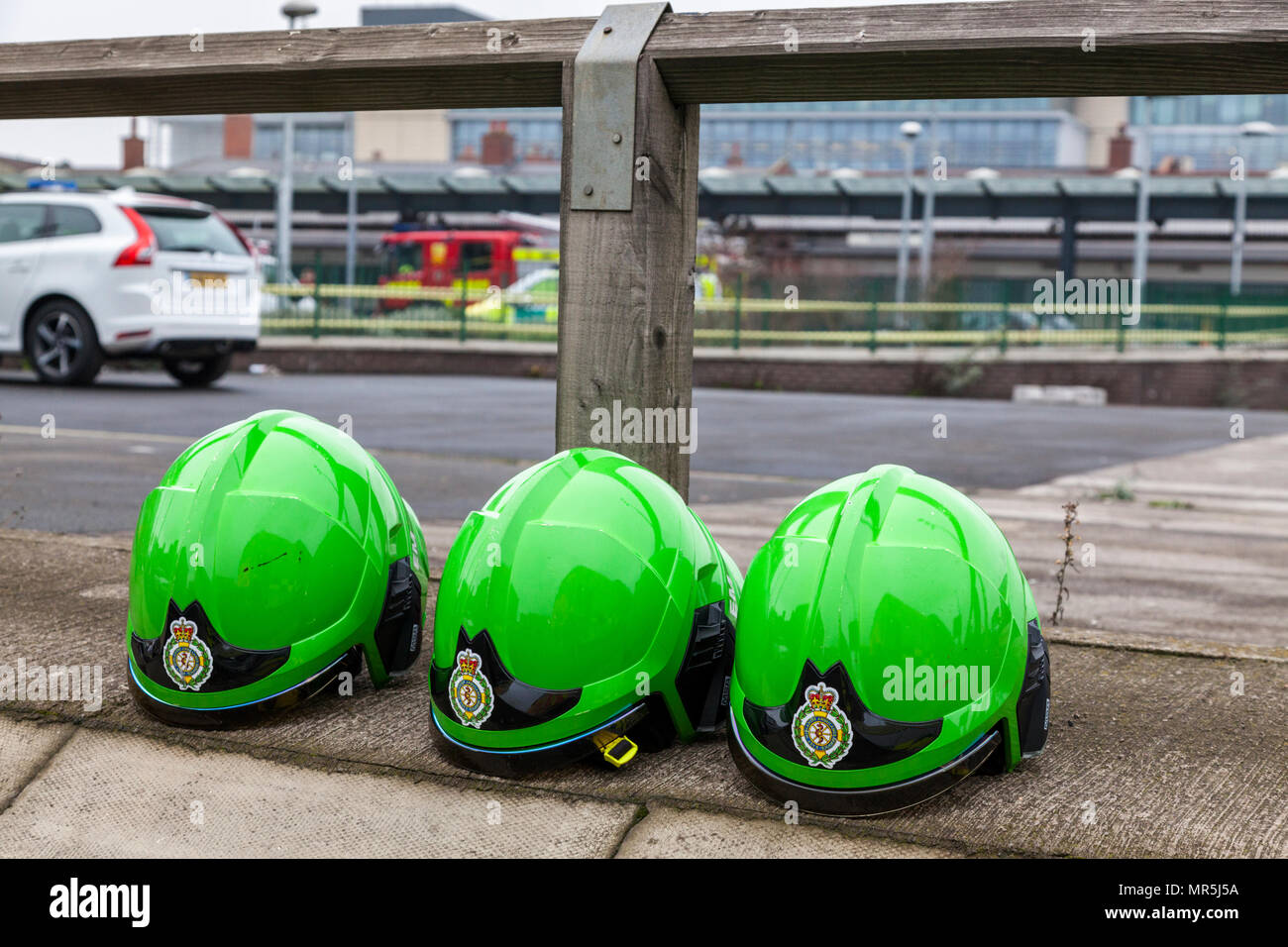 Three green helmets belonging to the ambulance crew of East Midlands Ambulance Service (EMAS), Nottingham, England, UK Stock Photo