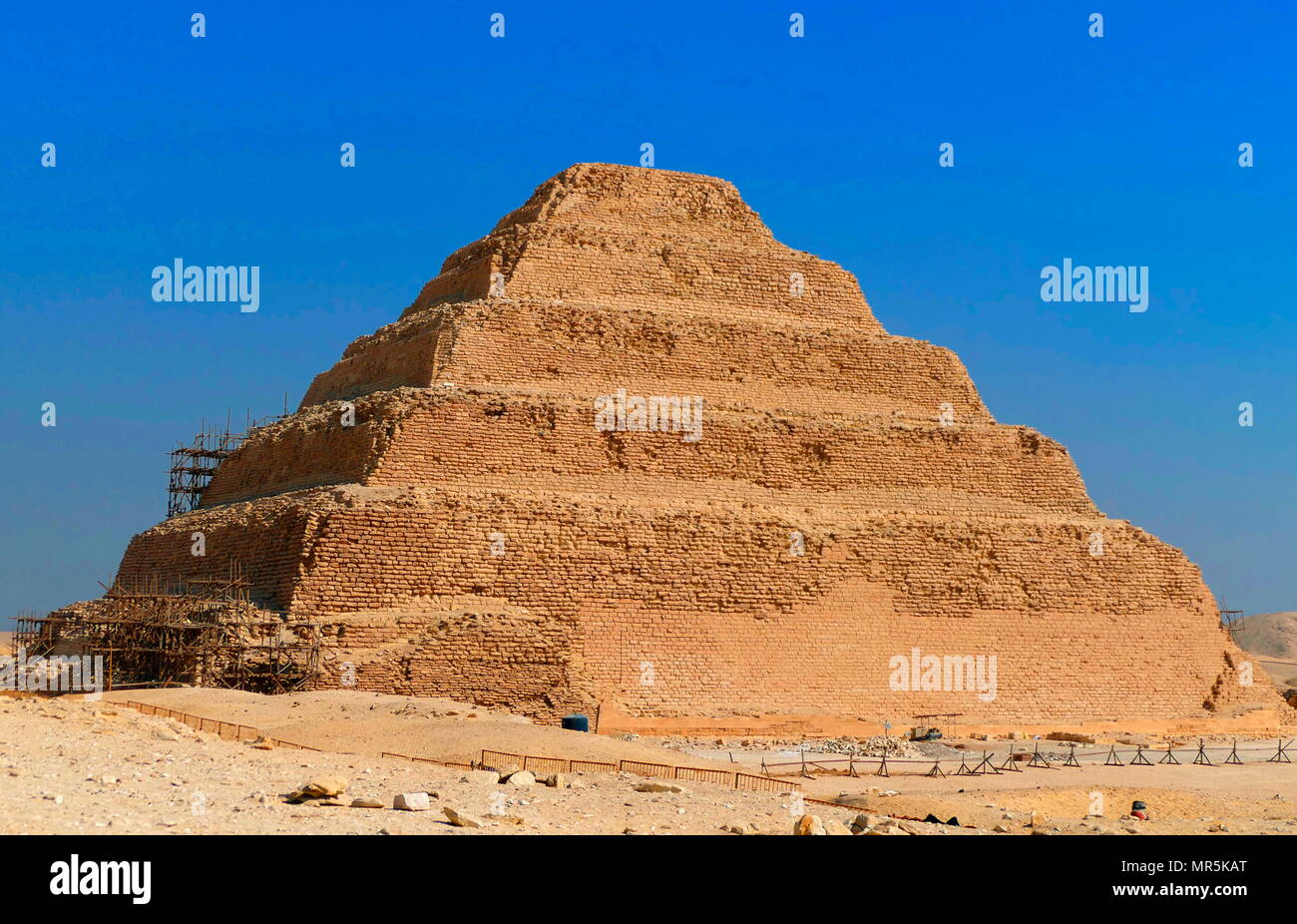 Step Pyramid of Djoser, at Saqqara, Egypt. Saqqara was an ancient burial ground in Egypt, serving as the necropolis for the Ancient Egyptian capital, Memphis. Djoser was the first or second king of the 3rd Dynasty (ca. 2667 to 2648 BC) of the Egyptian Old Kingdom (ca. 2686 to 2125 BC) Stock Photo