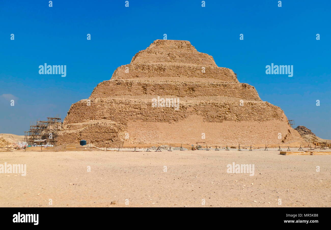 Step Pyramid of Djoser, at Saqqara, Egypt. Saqqara was an ancient burial ground in Egypt, serving as the necropolis for the Ancient Egyptian capital, Memphis. Djoser was the first or second king of the 3rd Dynasty (ca. 2667 to 2648 BC) of the Egyptian Old Kingdom (ca. 2686 to 2125 BC) Stock Photo
