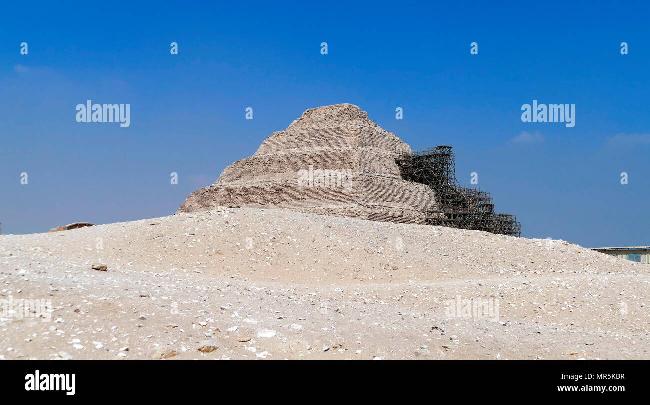 Step Pyramid of Djoser, at Saqqara, Egypt. Saqqara was an ancient burial ground in Egypt, serving as the necropolis for the Ancient Egyptian capital, Memphis. Djoser was the first or second king of the 3rd Dynasty (ca. 2667 to 2648 BC) of the Egyptian Old Kingdom (ca. 2686 to 2125 BC) Stock Photo