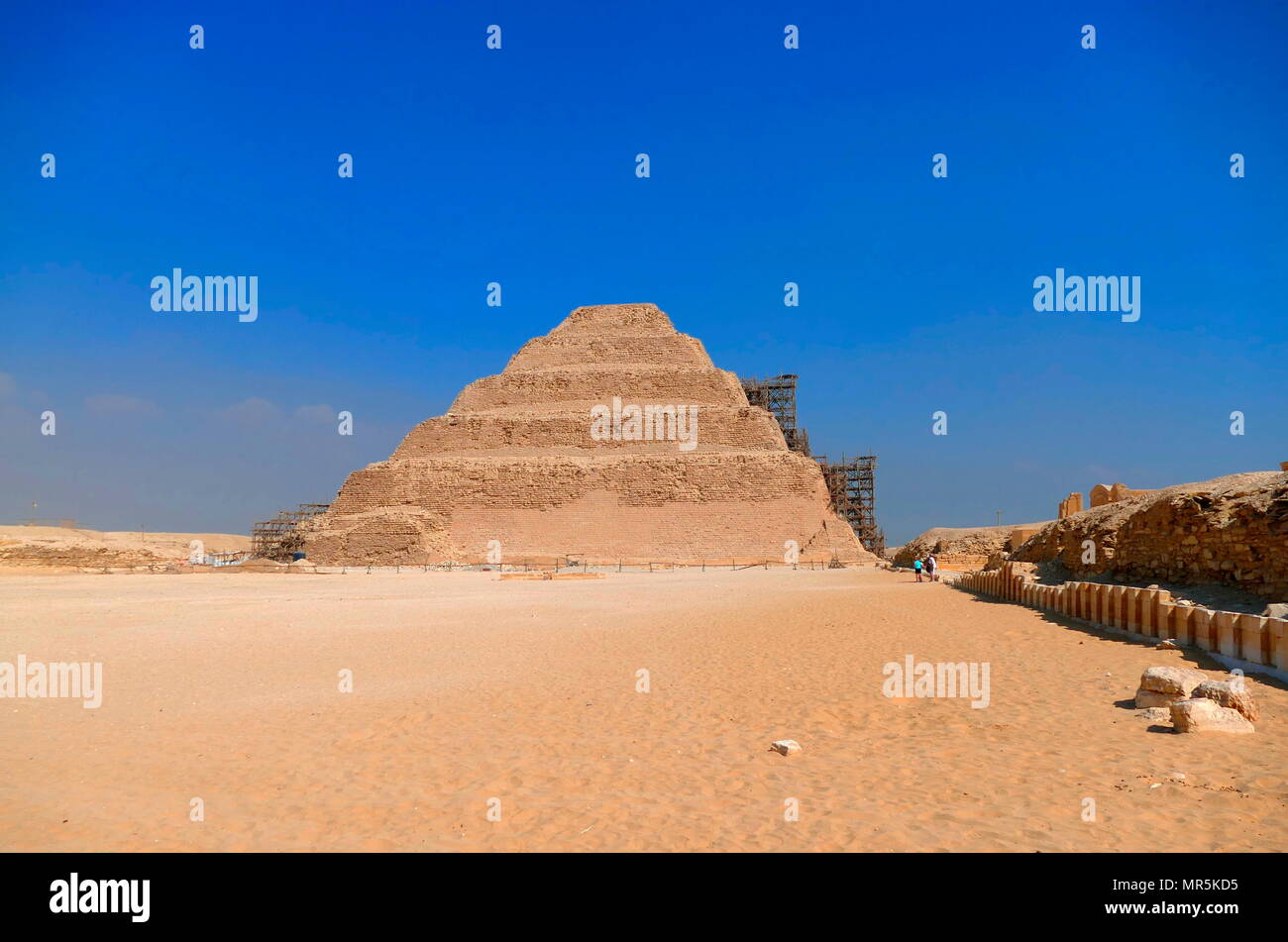 Step Pyramid of Djoser, at Saqqara, Egypt. Saqqara was an ancient burial ground in Egypt, serving as the necropolis for the Ancient Egyptian capital, Memphis. Djoser was the first or second king of the 3rd Dynasty (ca. 2667 to 2648 BC) of the Egyptian Old Kingdom (ca. 2686 to 2125 BC) Stock Photo