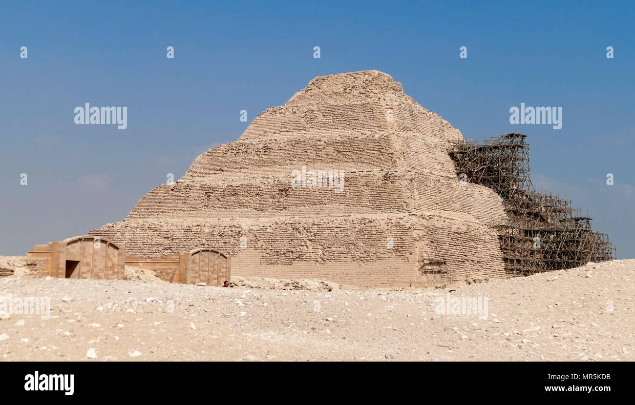 Step Pyramid of Djoser, at Saqqara, Egypt. Saqqara was an ancient burial ground in Egypt, serving as the necropolis for the Ancient Egyptian capital, Memphis. Djoser was the first or second king of the 3rd Dynasty (ca. 2667 to 2648 BC) of the Egyptian Old Kingdom (ca. 2686 to 2125 BC) Stock Photo