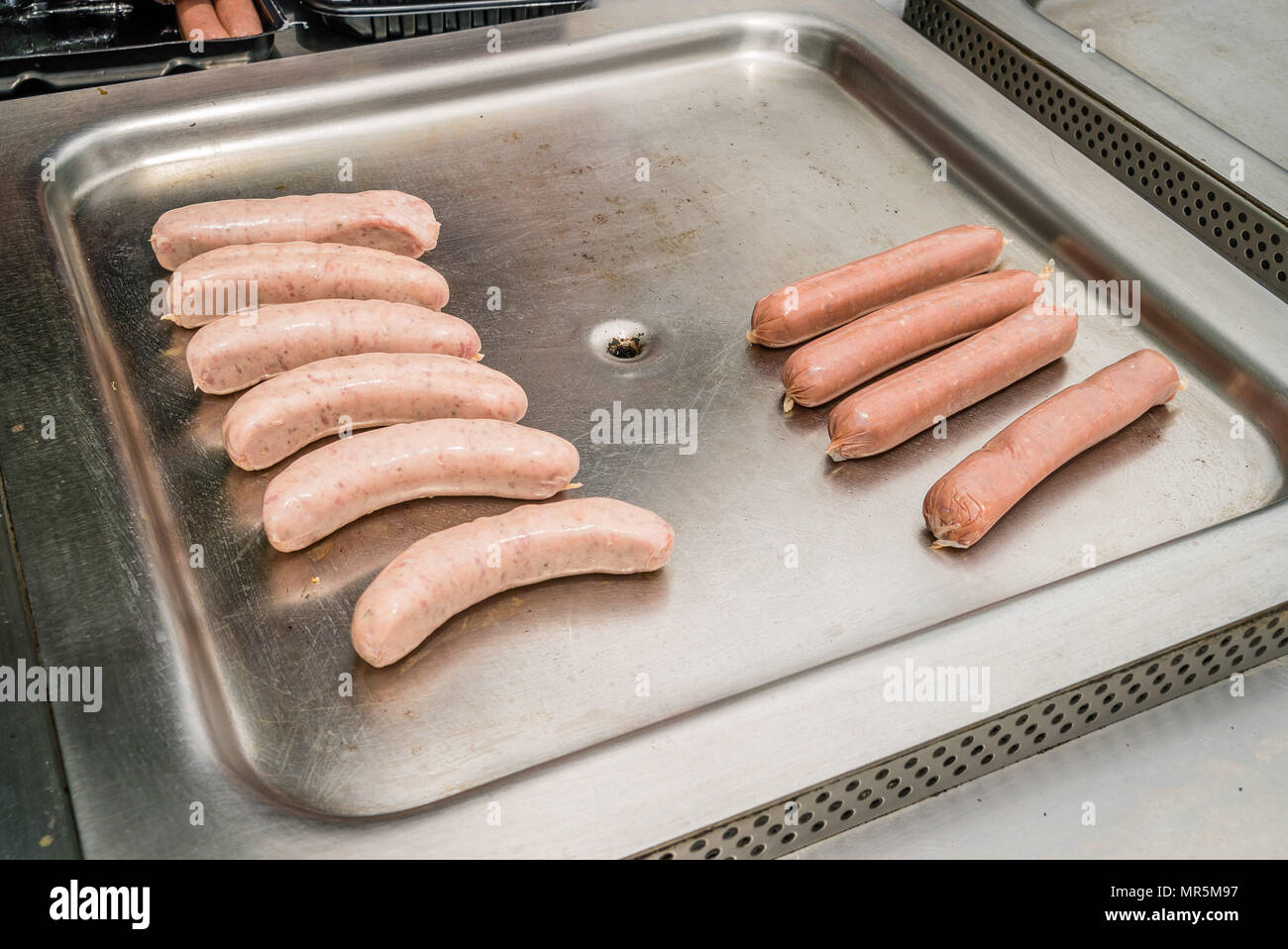 Public BBQ (barbecue) in Australia with sausages ready to be cooked