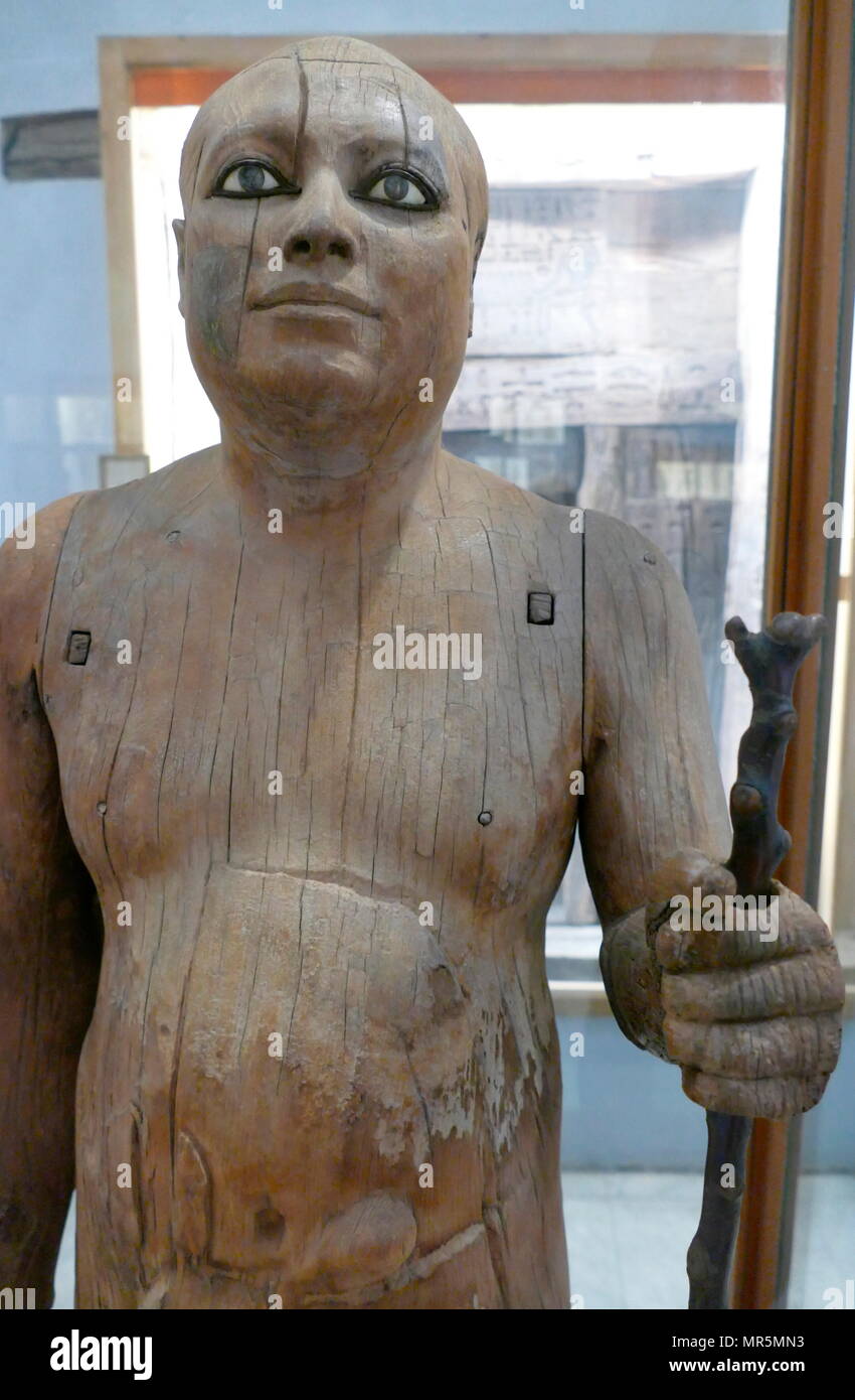 Wooden statue of Kaape (Sheikh el-Beled), an ancient Egyptian scribe and priest who lived between the late 4th Dynasty and the early 5th Dynasty,  2500 BC Stock Photo