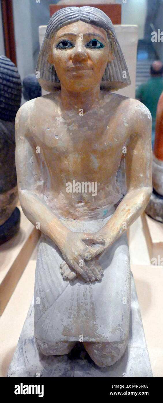 Statuette of Kaemked, funerary priest of the noble Urimi 2500 BC. Egyptian, painted limestone tomb object Stock Photo