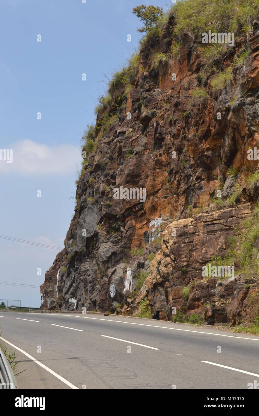 Road running by a cliff in Sri Lanka Stock Photo