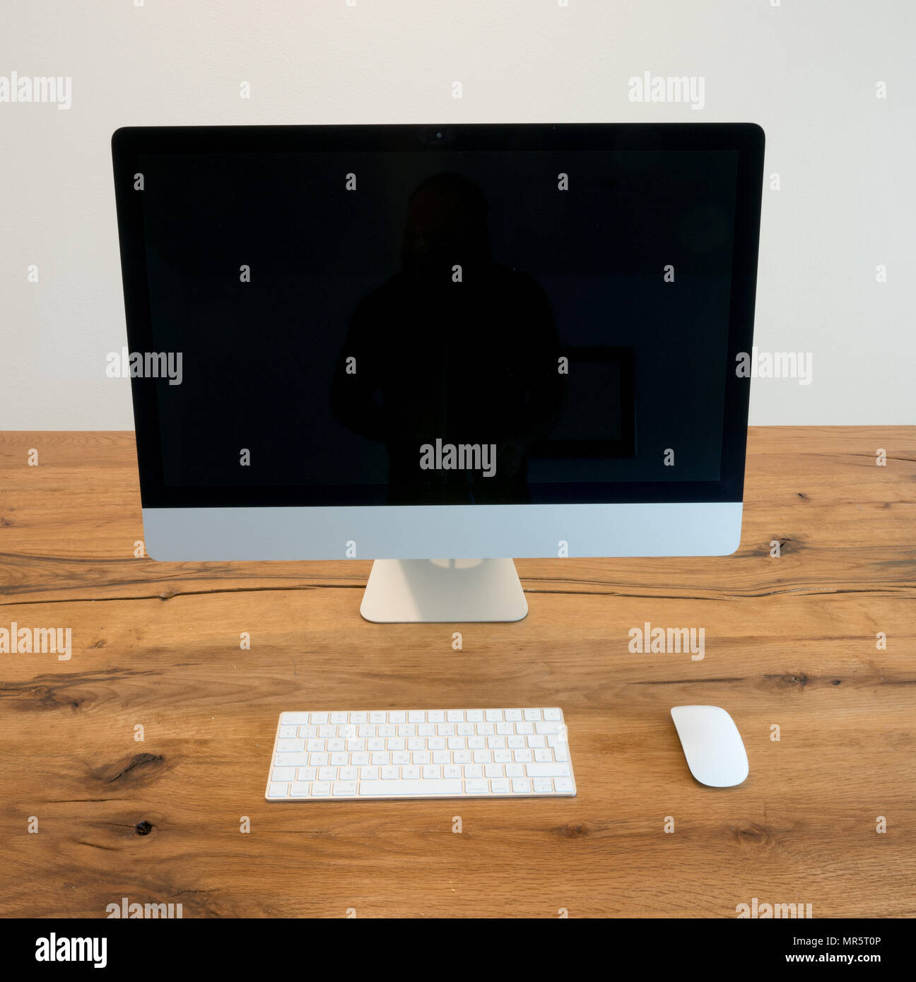 minimalist office with table and chair and computer Stock Photo - Alamy