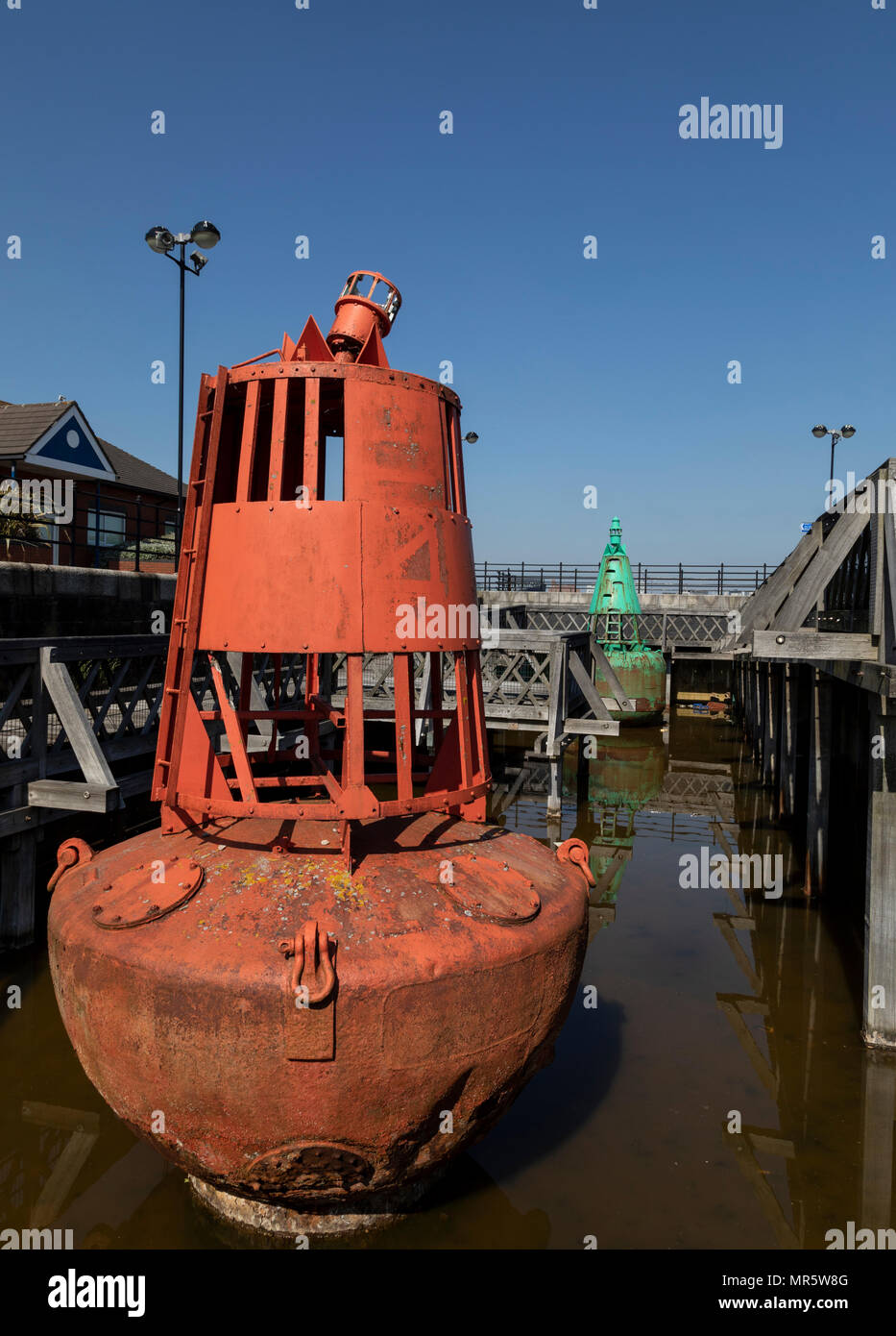 Red & green buoys at Woodside Ferry, Birkenhead, Wirral, stored next to the ferry terminal Stock Photo