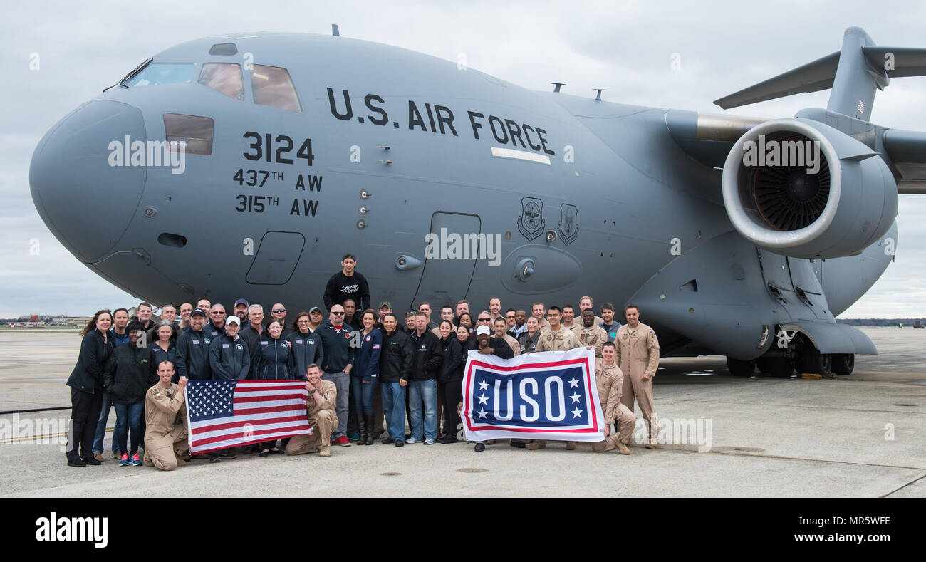 U.S. Air Force Gen. Paul J. Selva, Vice Chairman of the Joint Chiefs of Staff, USO Entertainers, and the C-17 flight crew, pose for a final group photo after landing at Joint Base Andrews April 1, 2017. Gen. Selva, along with USO entertainers, visited service members who are stationed outside the continental U.S. at various locations across the globe. This year’s entertainers included country musician Craig Morgan, mixed-martial artist Dominick Cruz, chef Robert Irvine, U.S. Olympic Swimmer Katie Meili, and mentalist Jim Karol. (DoD Photo by U.S. Army Sgt. James K. McCann) Stock Photo