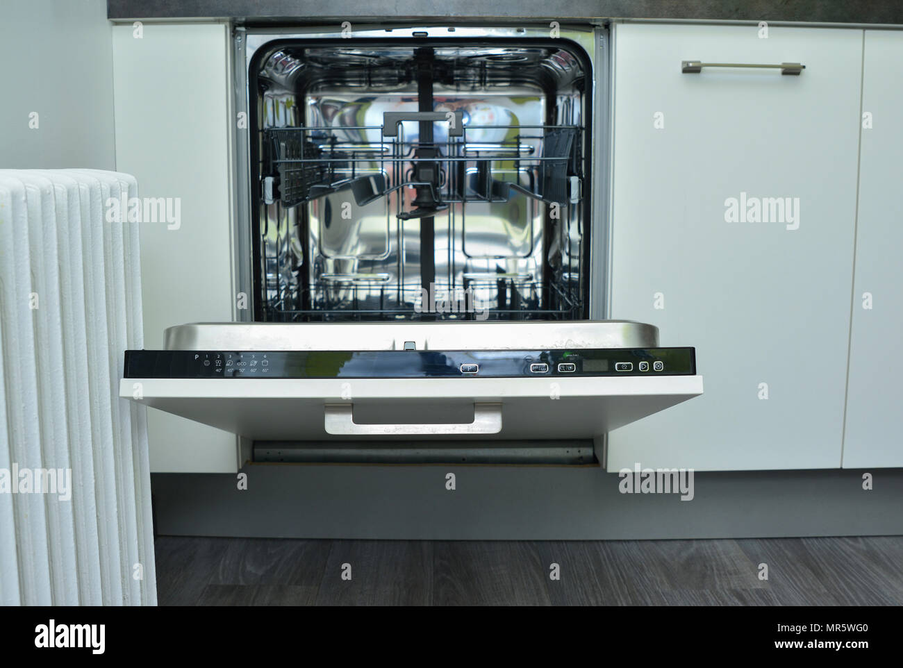Modern white dishwasher with an open door Stock Photo Alamy