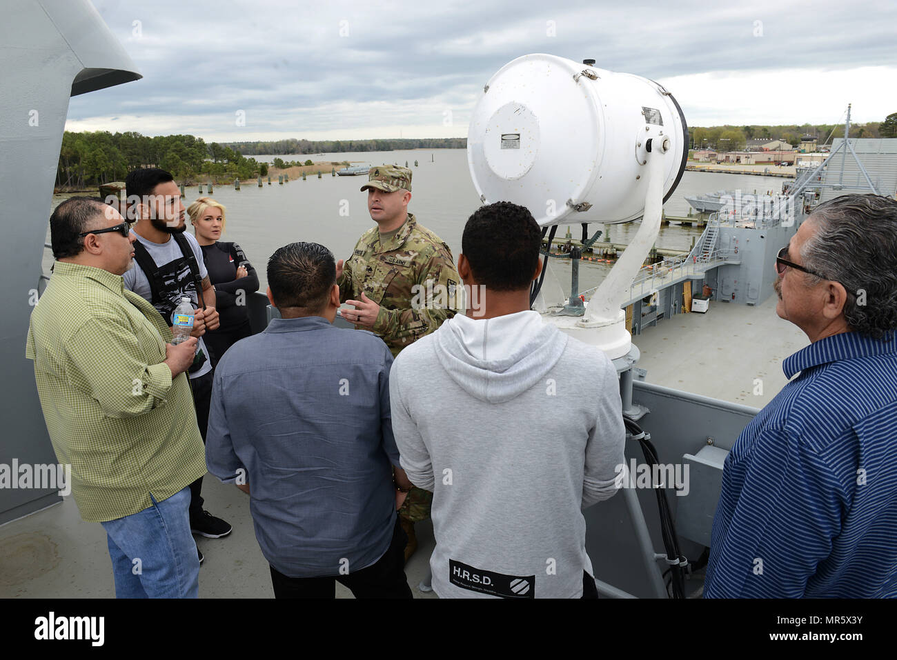 U.S. Army Staff Sgt. Ralph Genovese, 335th Transportation Detachment training NCO, guides UFC Fighters and guests on a tour of the Logistic Support Vessel Gen. Frank S. Besson Jr. at Joint Base Langley-Eustis, Va., April 6, 2017. The fighters interacted with community members during meet-and-greet events at the Fort Eustis Exchange, bowling alley and Anderson Field House. (U.S. Air Force photo/Staff Sgt. Teresa J. Cleveland) Stock Photo